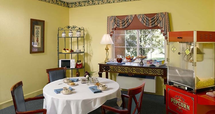 Cozy dining area with popcorn machine and snacks