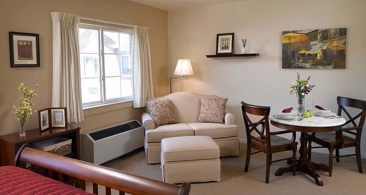 Cozy resident room with seating and dining area