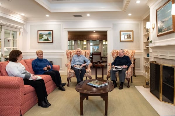 Residents socializing in a cozy common area