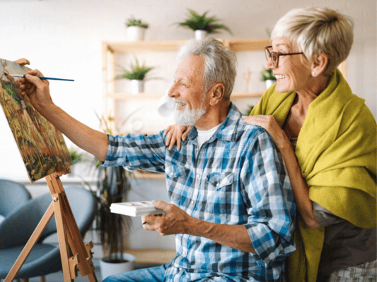 Seniors enjoying a painting activity together