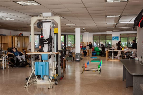 Residents engaged in therapy activities in a recreational room