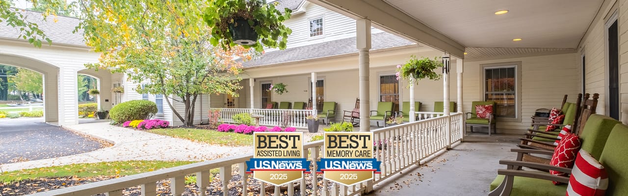 Outdoor seating area with flowers and greenery