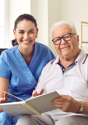 Staff member with resident smiling together