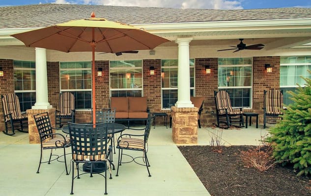 Outdoor seating area with umbrella and chairs