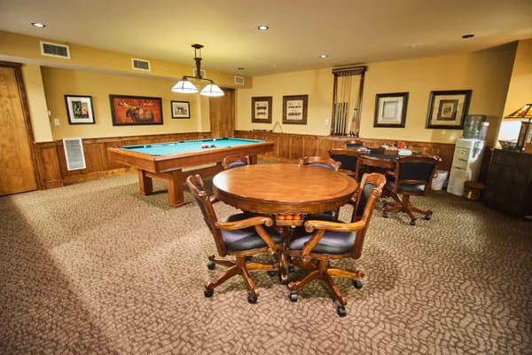 Interior activity room with pool table and seating