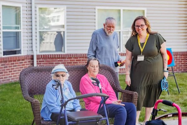 Residents enjoying time outdoors on a bench