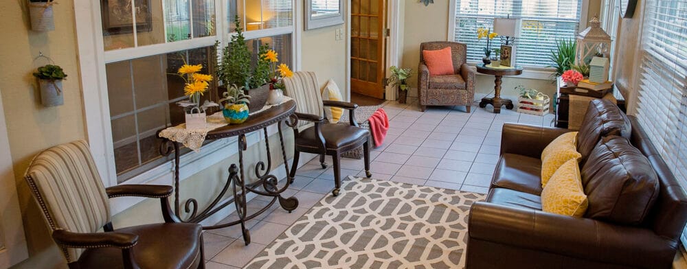 Bright common area with comfortable seating and plants
