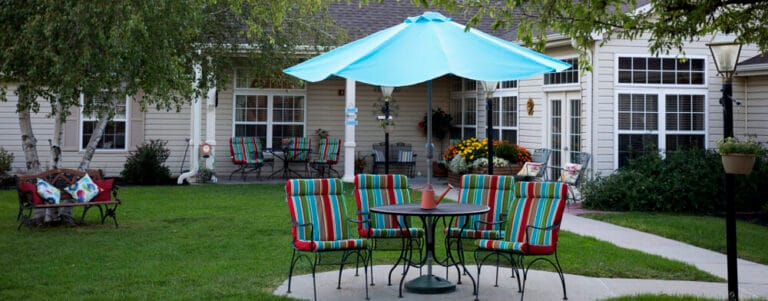 Outdoor seating area with colorful chairs and umbrellas