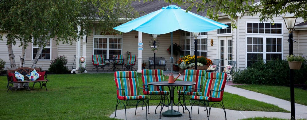 Outdoor seating area with colorful chairs and umbrellas