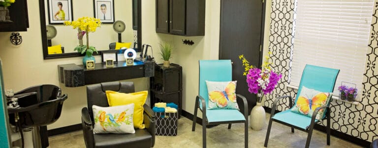 Interior view of a vibrant beauty salon with chairs and decorations