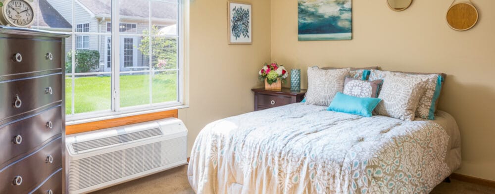 Cozy bedroom with natural light and a welcoming decor