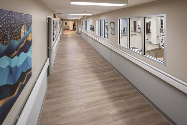 Interior corridor with exercise area and artwork