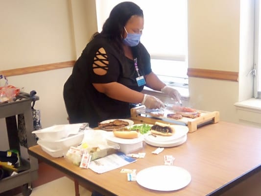 Staff preparing food in a dining area