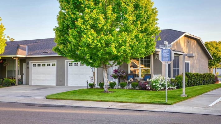 Exterior view of a senior living residence with landscaping