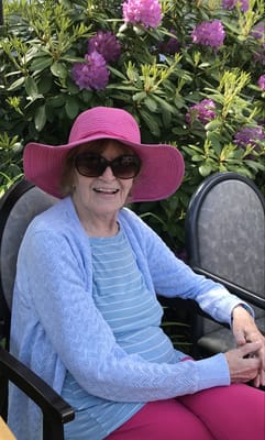 Senior resident enjoying the outdoors in a garden