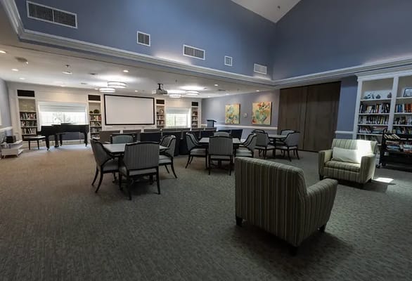 Bright common area with seating and bookshelves