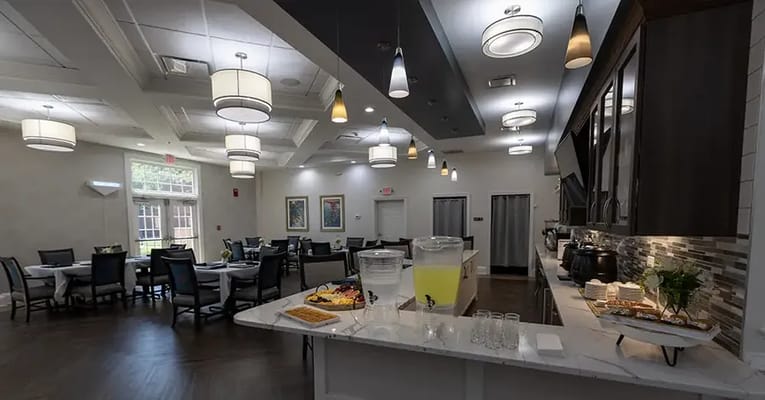 Bright dining area with food and tables set up