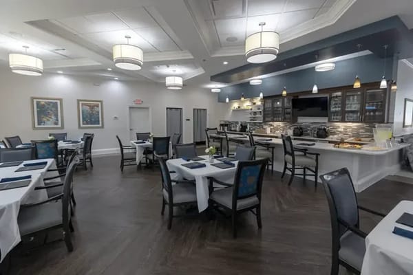 Bright dining room with tables set for meals