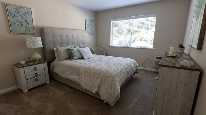 Cozy resident room with a comfortable bed and decor