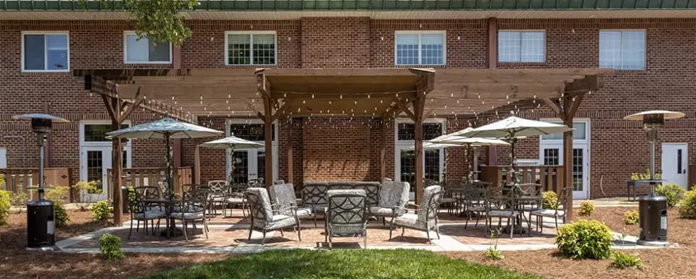 Outdoor patio area with seating and umbrellas