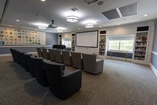 Bright common area with seating and bookshelves