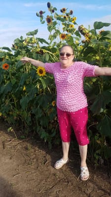 Resident enjoying a sunny day in a sunflower field