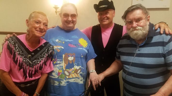 Residents and staff celebrating together in a cheerful gathering