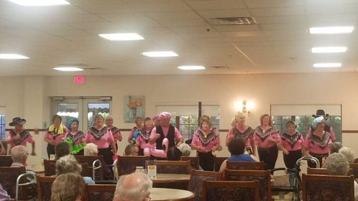 Residents enjoying a performance in a common area