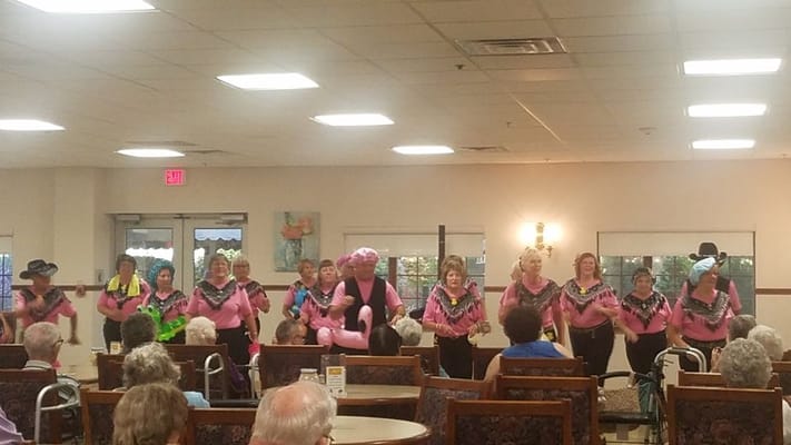 Residents enjoying a performance in a common area