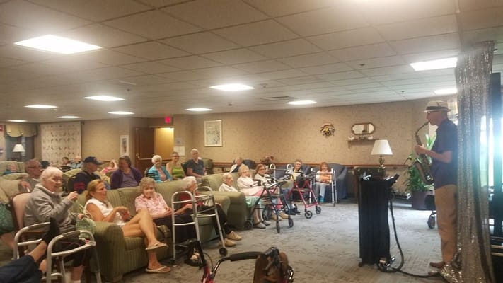Residents enjoying a live music performance in a common area