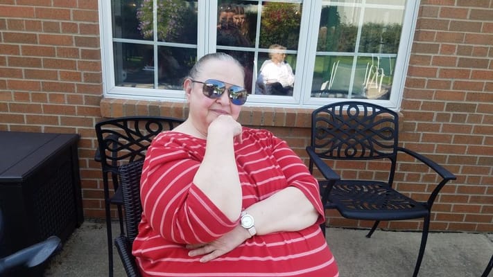Resident enjoying the outdoors with sunglasses on