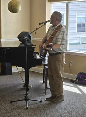 Resident performing music in a common area