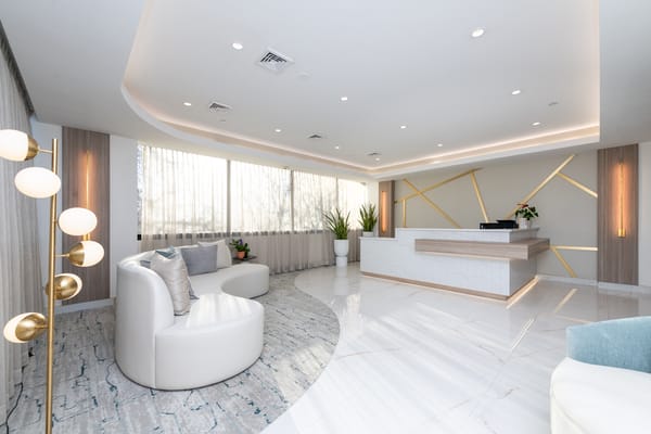 Bright, modern lobby with seating and a reception desk