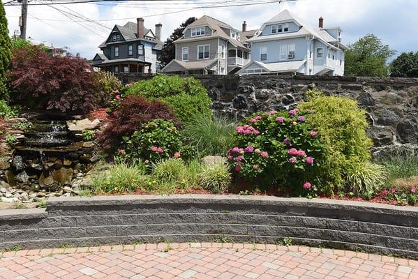 Beautiful garden area with flowers and a water feature