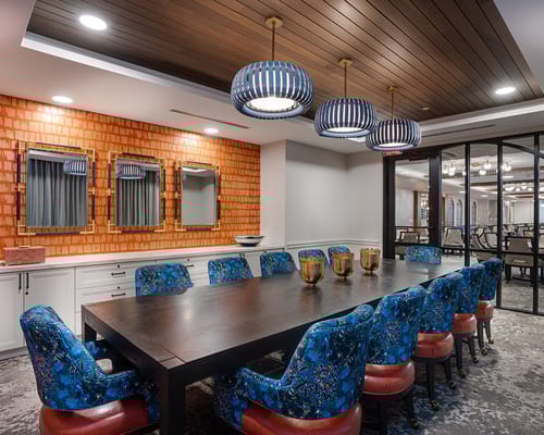 Modern dining area with colorful furniture and lighting