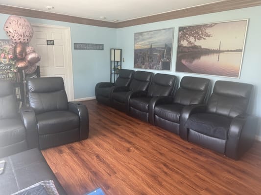 Common area with reclining chairs and birthday decorations