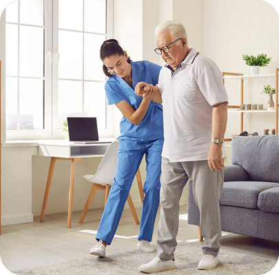 A caregiver assisting a resident in a bright room