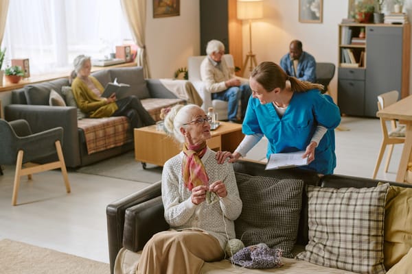 Residents and staff interacting in a common area