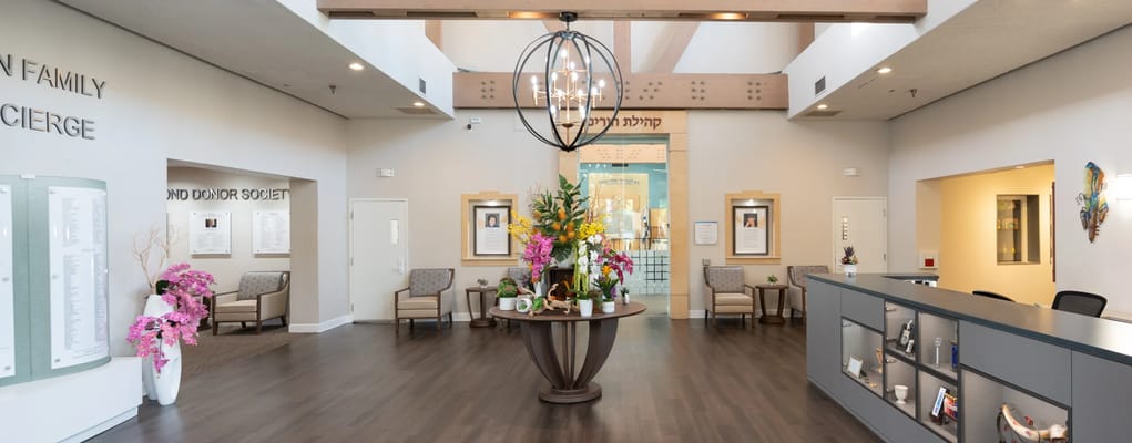 A common area in a senior living facility with floral decor