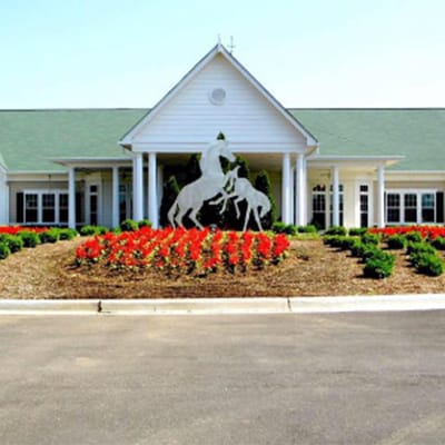 Exterior view of a senior living facility with flowers
