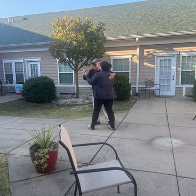 Residents dancing in an outdoor space at Daisy Hill