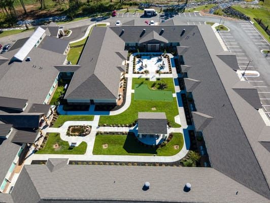 Aerial view of a senior living courtyard and garden