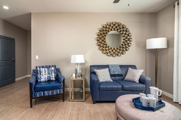 Well-furnished living room in a senior living facility