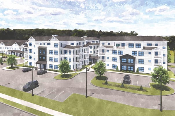 Exterior view of a senior living facility with parking