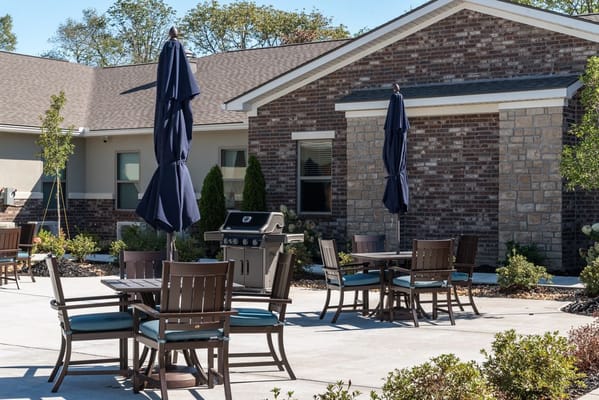 Outdoor seating area with tables and umbrellas