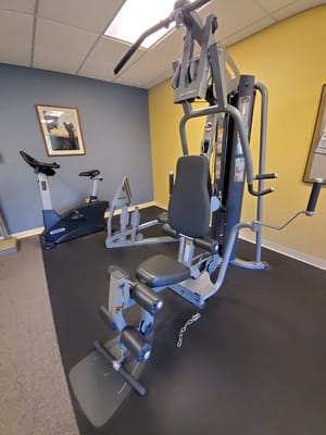 Fitness equipment in a well-lit exercise room