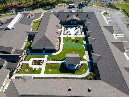 Aerial view of the Crestview Senior Living facility with gardens