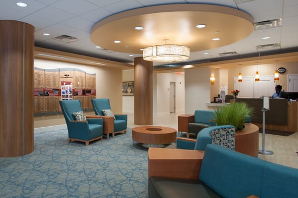 Bright common area with seating and reception desk