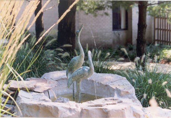Bronze sculpture fountain in an outdoor space