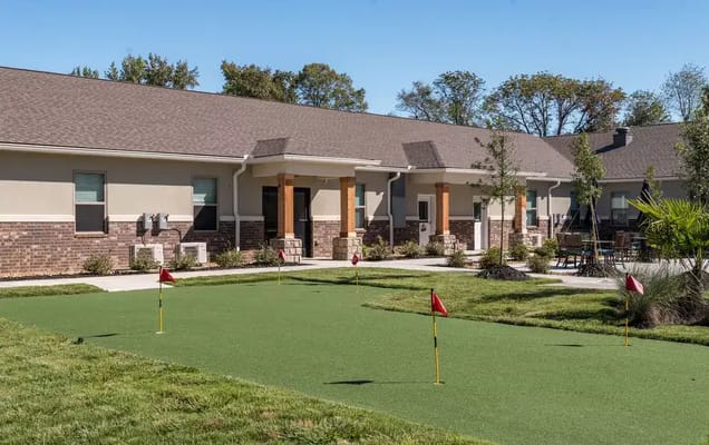 Outdoor putting green with flags at Crestview Senior Living